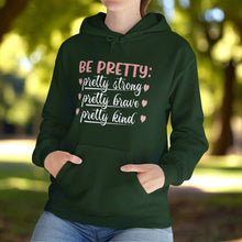 Be Pretty hooded sweatshirt features a classic pullover design with a 