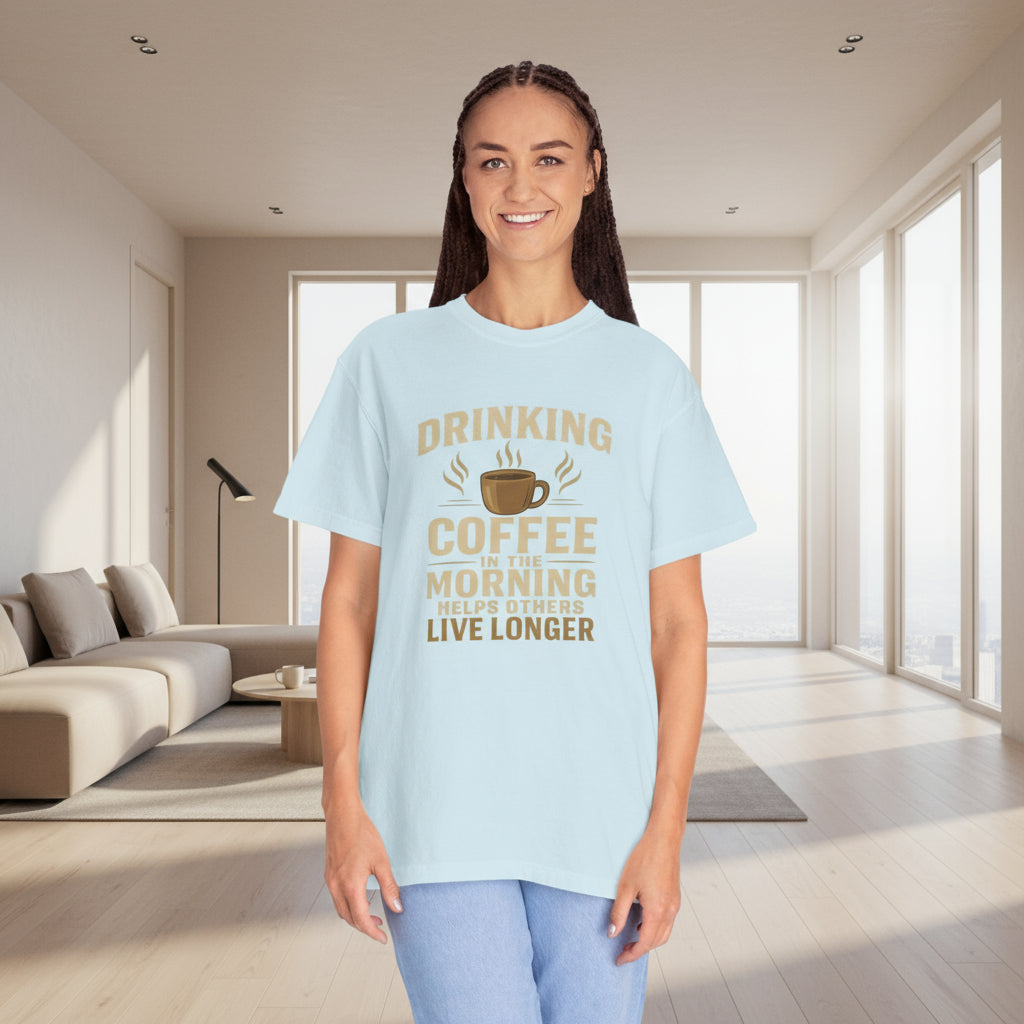 Woman wearing a light blue t-shirt with a coffee-themed message on a white background