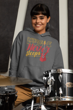 Music Never Sleeps hooded sweatshirt features a classic pullover desig